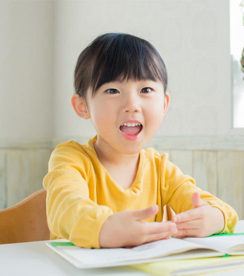 Primary student in yellow at learning centre in singapore 1